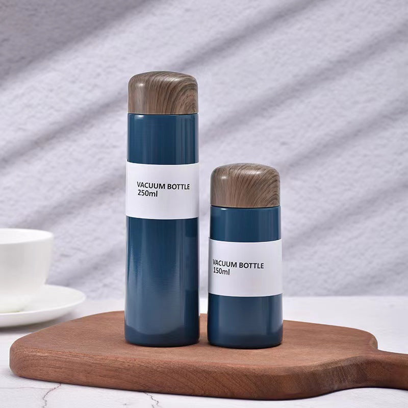Damen vakuumisolierte Wasserflasche mit innovativem Holzdeckel Brehn