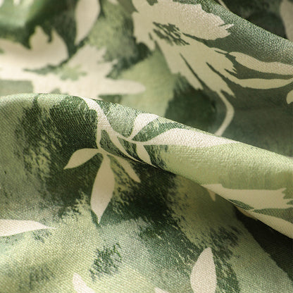 Dekorativer Kurzflor-Teppich mit gewelltem Rand und floralem Aquarellmuster Brehn
