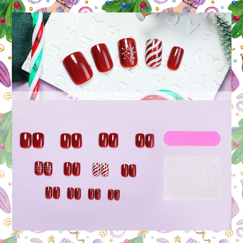 Kunstnagelset mit festlichen Designs und Glitzerakzenten Brehn