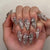 Dekorativer Stiletto Press-On Nagelset Brehn