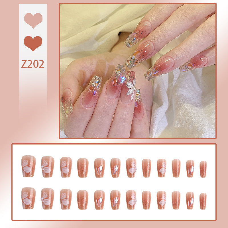 Kunstnagelset mit floralen und glitzernden Akzenten Brehn