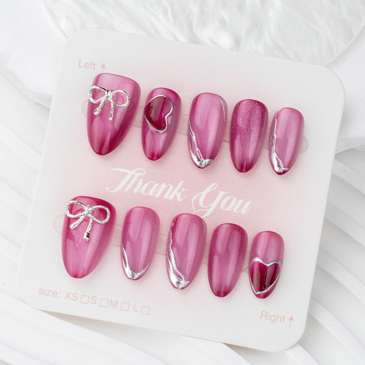 Kunstnagelset mit eleganten Herz- und Schleifenverzierungen Brehn