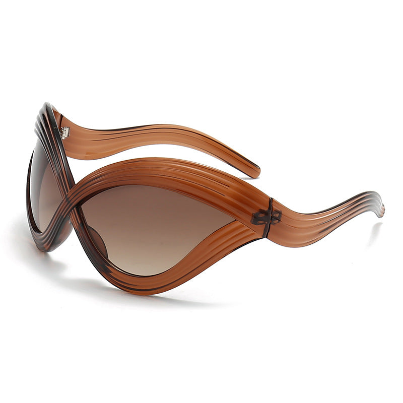 Damen außergewöhnliche Sonnenbrille mit geschwungenem Design Brehn