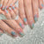 Kreatives Kunstnagelset mit farbenfrohem Ombre-Effekt und wunderschönen Verzierungen Brehn