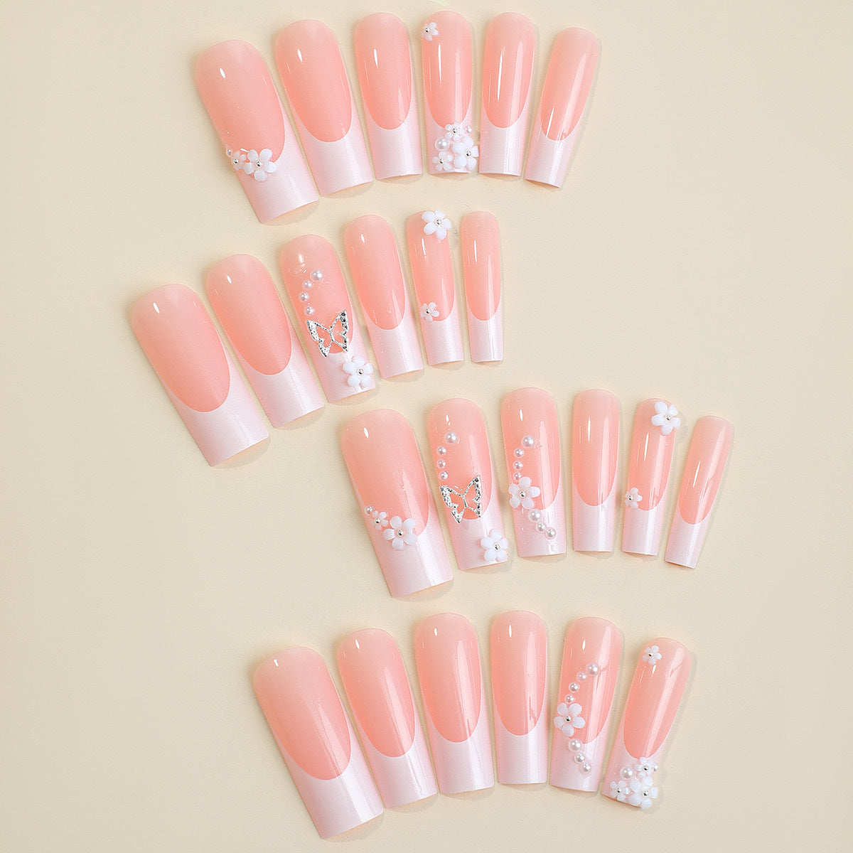 Kunstnagelset mit bezaubernden Blumen- und Schmetterlingsakzenten Brehn