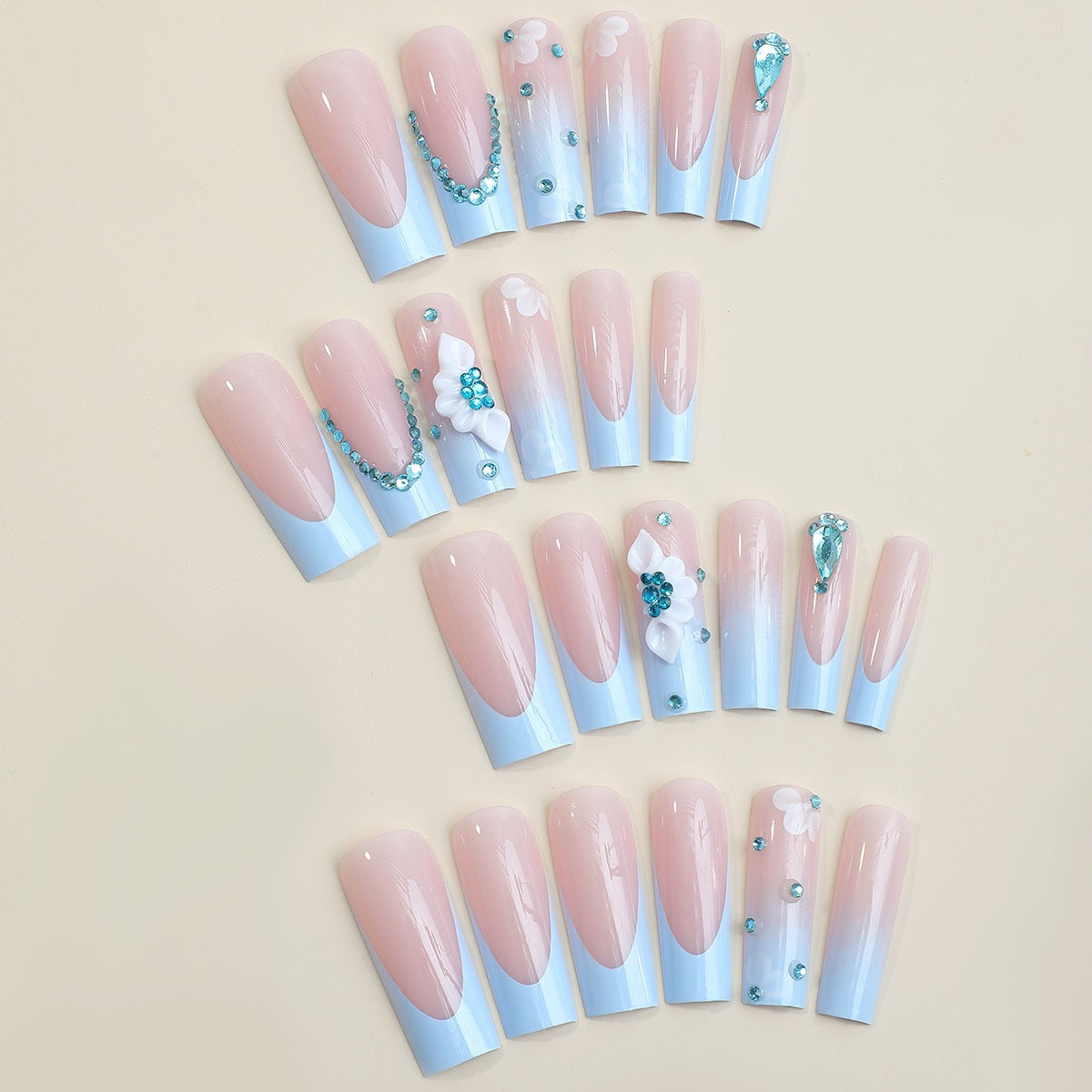 Kunstnagelset mit luxuriösen Dekorationen und zartem Ombre-Effekt Brehn