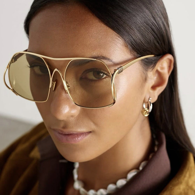 Damen geometrische Sonnenbrille mit schmalem Metallrahmen und braunen Gläsern Brehn
