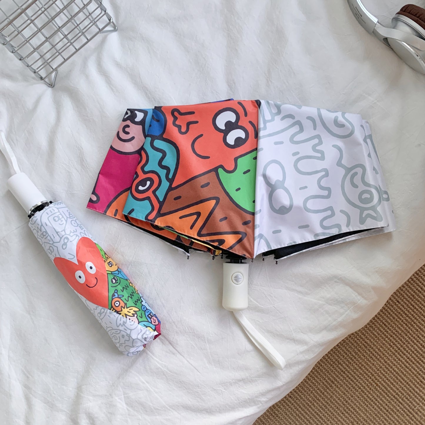 Damen Faltregenschirm mit bunten Comic-Motiven Brehn
