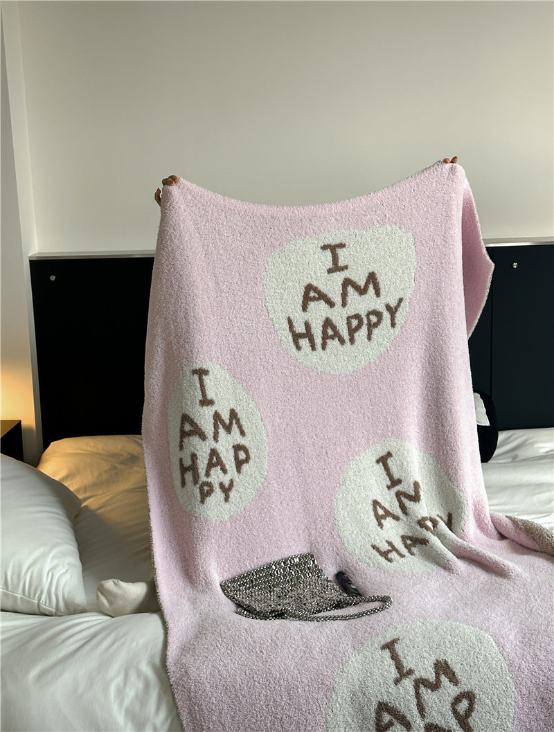 Kuscheldecke mit großem Schriftmotiv und weichem Bouclégewebe