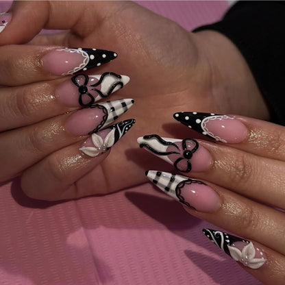 Kunstvolle Stiletto-Nägel mit floralen und geometrischen Akzenten Brehn