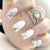 Elegante Kristallakzent Press-On Nagelspitzen Brehn