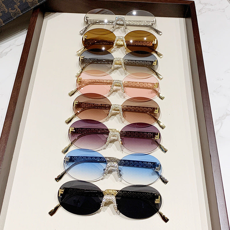 Damen Sonnenbrille mit glitzerndem Rahmen und ovalen Gläsern Brehn