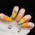 Kunstnägel mit fruchtigem Mango-Design Brehn