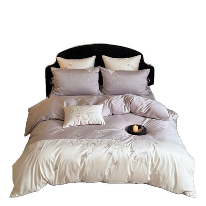Luxuriöses besticktes Satin-Bettwäscheset mit Wendefunktion und Zierkissen