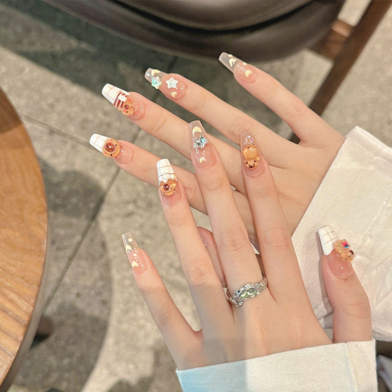 Kunstnagelset mit charmantem Tierdesign und funkelnden Kristallverzierungen Brehn