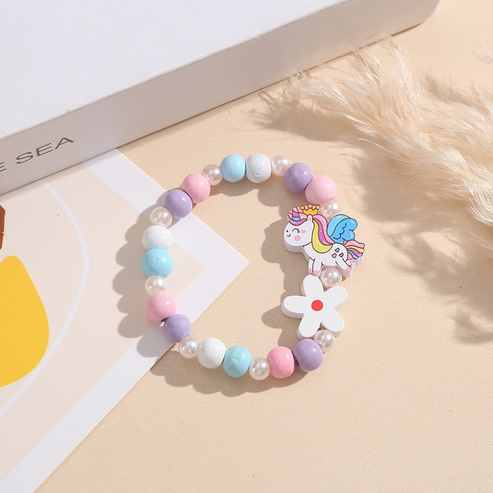 Verspieltes Kinderarmband mit Einhorn- und Blumenmotiv Brehn