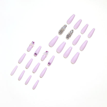 Kunstvolle Stiletto-Nägel mit Glitzer- und Blumenverzierungen Brehn