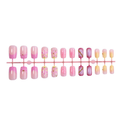 Künstliche Nagelkollektion mit floralem Design und Glitzerakzenten Brehn