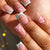 Kunstnägel mit floralem Design und Glitzerdetails Brehn