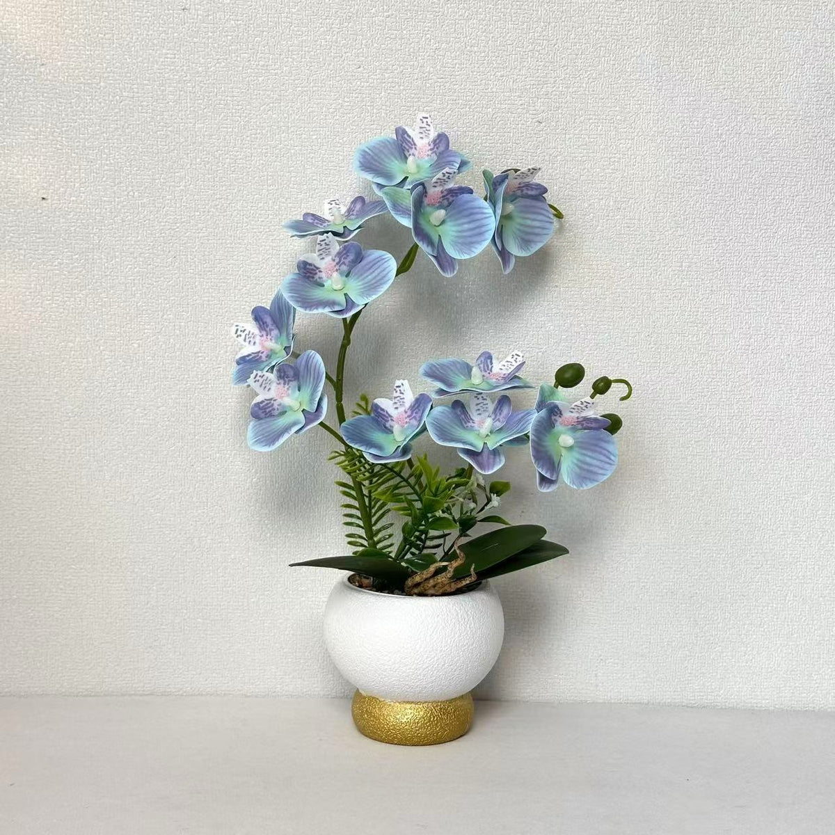 Künstliche Orchideenarrangement für Tischdekoration
