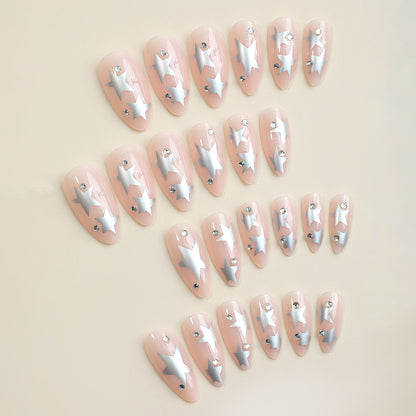 Kunstnagelset mit glamourösen Sternen-Akzenten Brehn