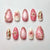 Kunstnagelset mit eleganten Blüten- und Glitzerdetails Brehn