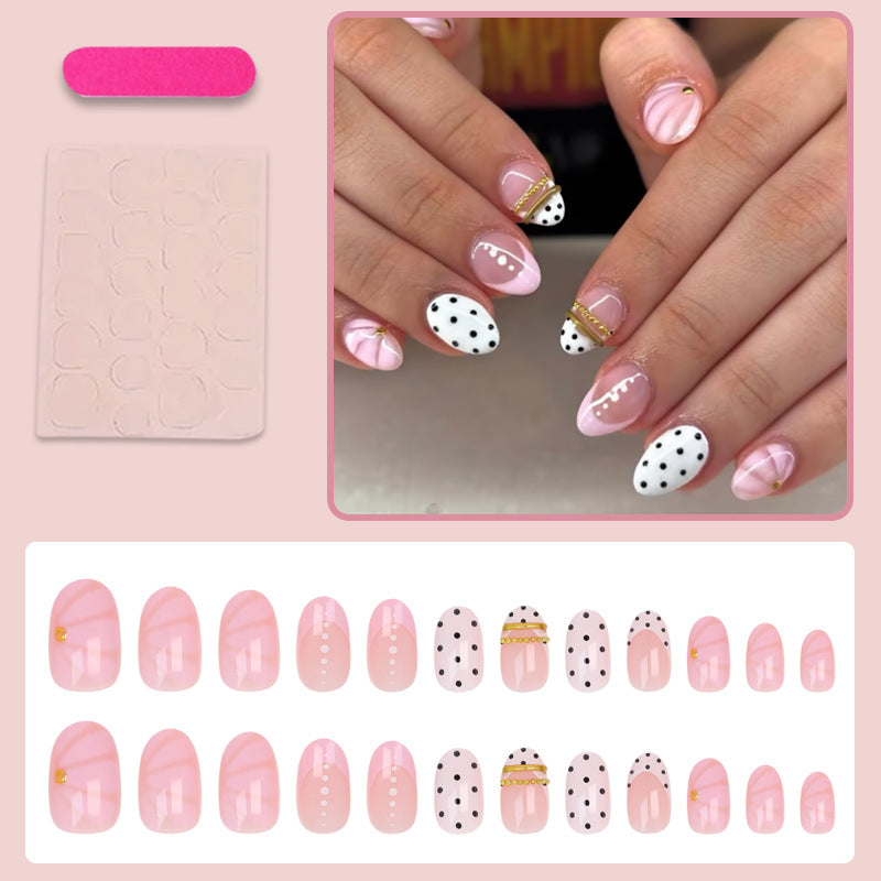 Kunstnagelset mit elegantem Polka-Dot und glamourösen goldenen Akzenten Brehn