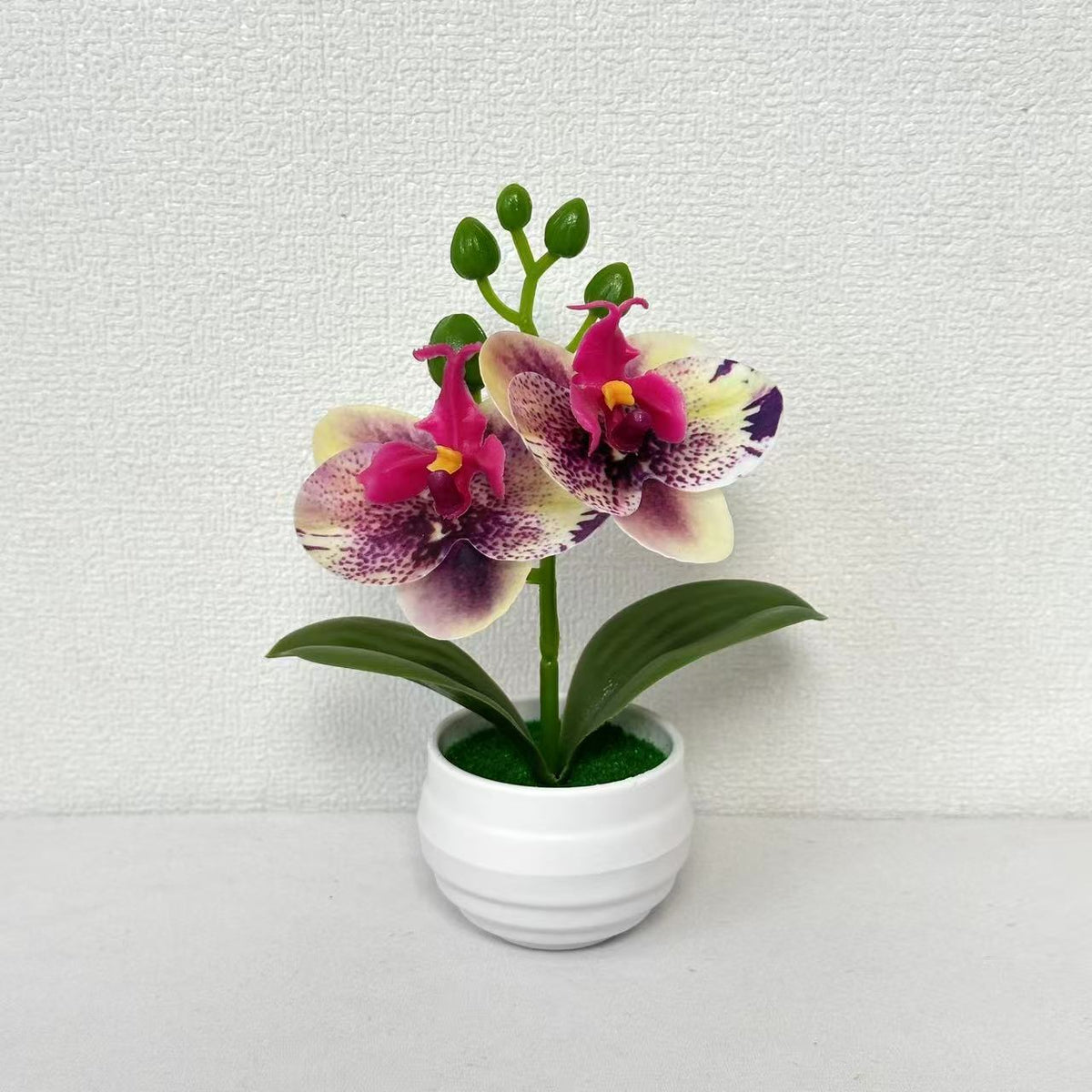 Lebensechte künstliche Orchideenpflanzenanordnung für die Innendekoration