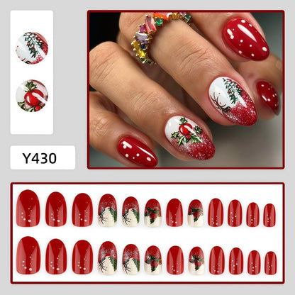 Weihnachtskunstnägel mit festlichem Glitzermuster und Weihnachtsmotiven Brehn