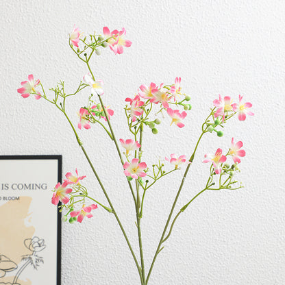 Künstlicher Blütenzweig mit zarten blauen Blumen und grünen Beeren Brehn