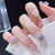Kunstnagelset mit funkelnden Glitzer-Elementen und ansprechendem Ombre-Design Brehn