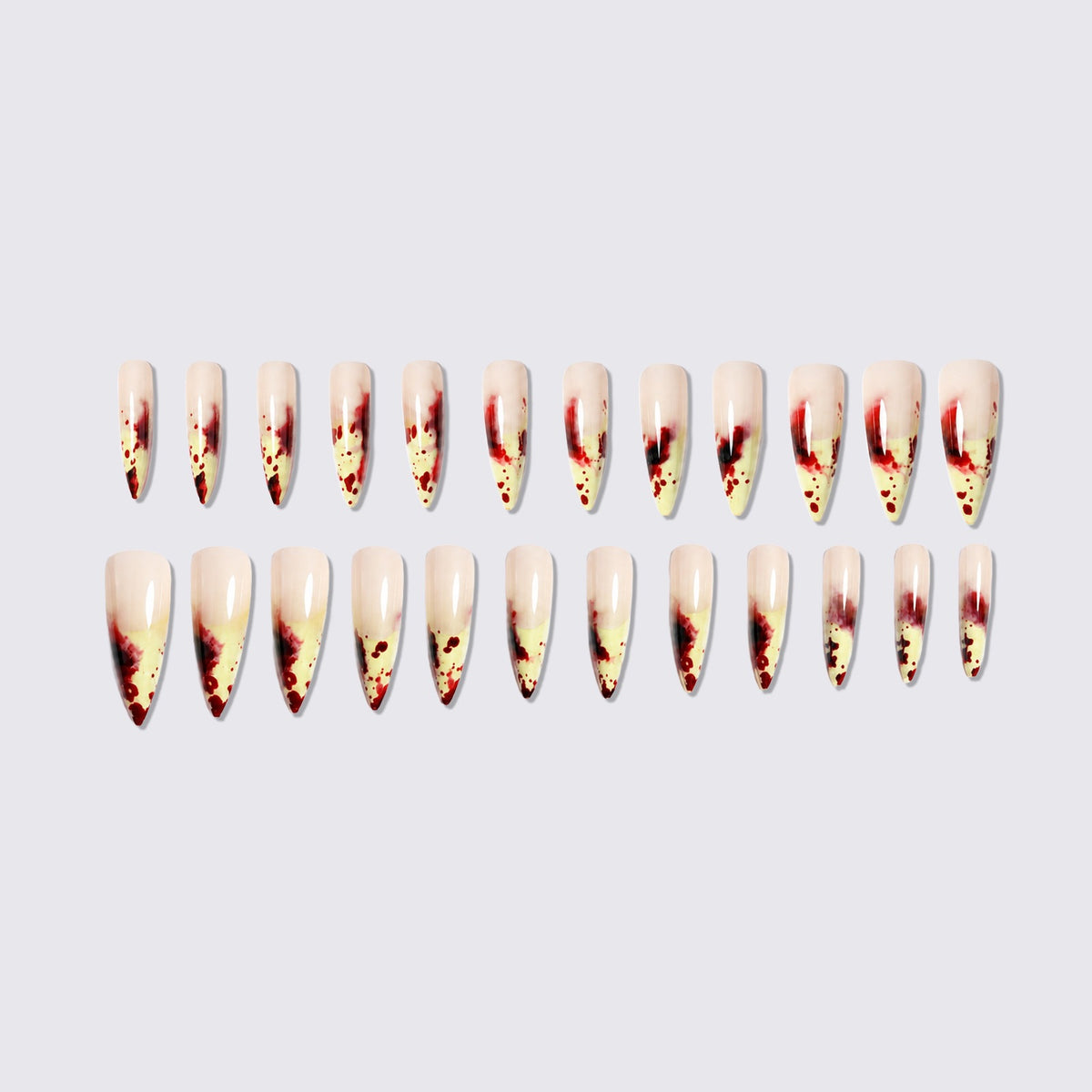 Kunstnagelset mit blutigen Akzenten und elegantem Stiletto-Design Brehn