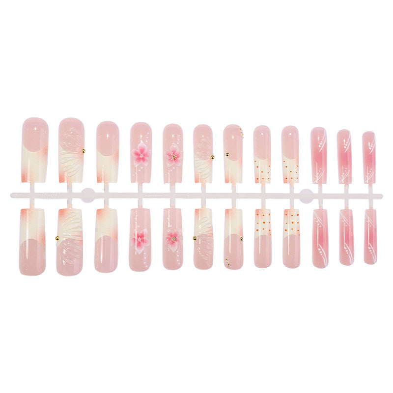Kunstnagelset mit filigranen Blüten- und Glitzerakzenten Brehn