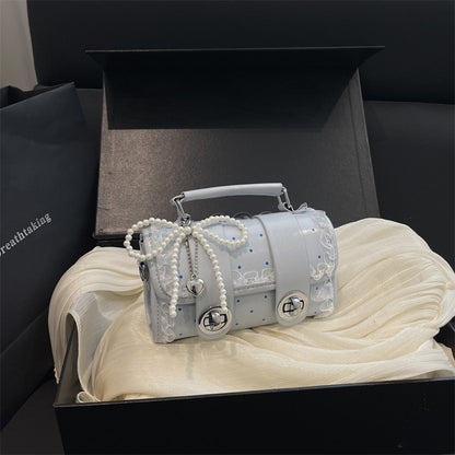 Dekorative kompakte Handtasche