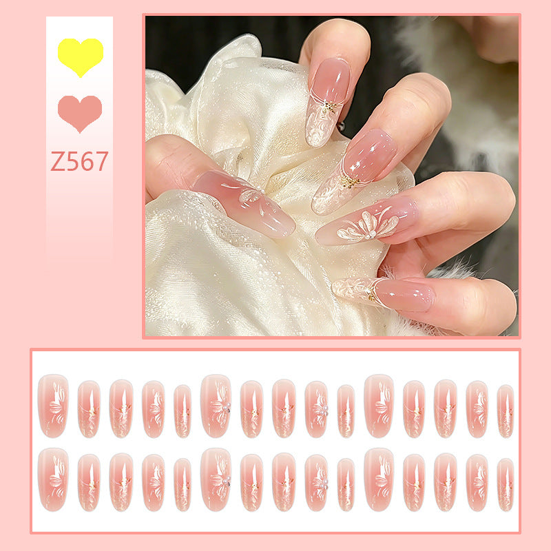 Kunstnagelset mit filigranen Blumen- und Glitzerelementen Brehn