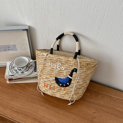 Bestickte Strohmärktasche