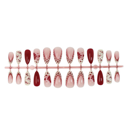 Kunstnagelset mit kreativen Blüten- und Rautenmustern Brehn