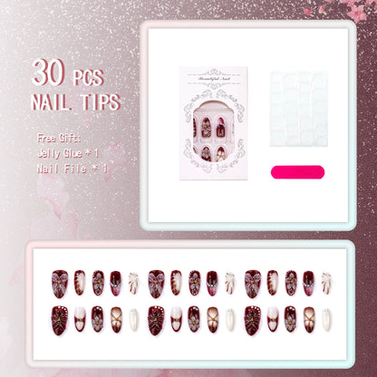 Dekorativer Press-On-Nagelset mit floralen und Edelsteinakzenten
