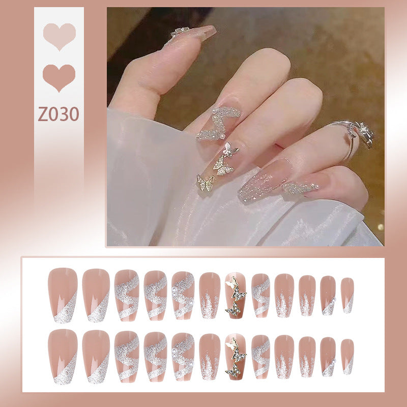 Kunstnagelset mit funkelnden Schmetterlingen und glitzernden Verzierungen Brehn