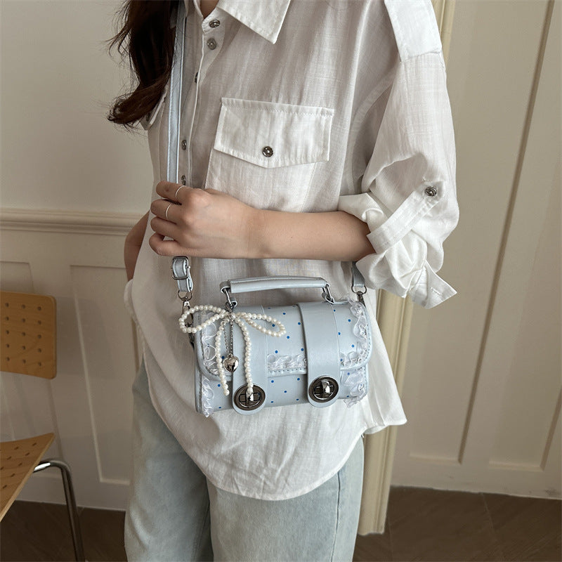 Dekorative kompakte Handtasche