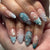 Kreatives Kunstnagelset mit maritimen Akzenten und Glitzerverzierungen Brehn