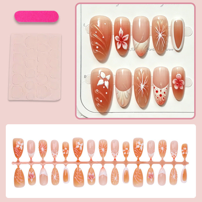 Kunstnagelset mit floralen Akzenten und elegantem Ombre-Effekt Brehn