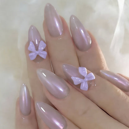 Kunstnagelset mit eleganten Schleifchen und sanftem Design Brehn