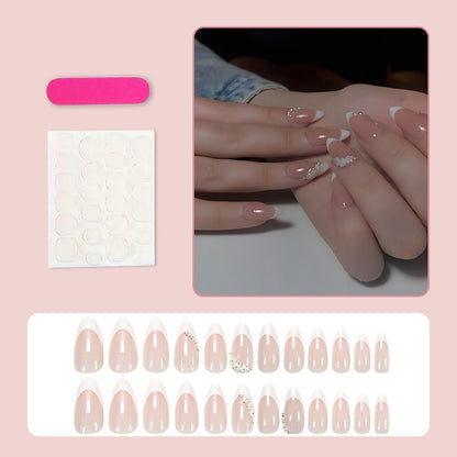 Kunstnagelset mit romantischen Blüten- und Glitzerverzierungen Brehn