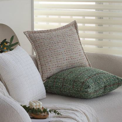 Quadratischer Bouclé-Kissenbezug im Tweedstil mit dezentem Multicolor‑Tufting Brehn