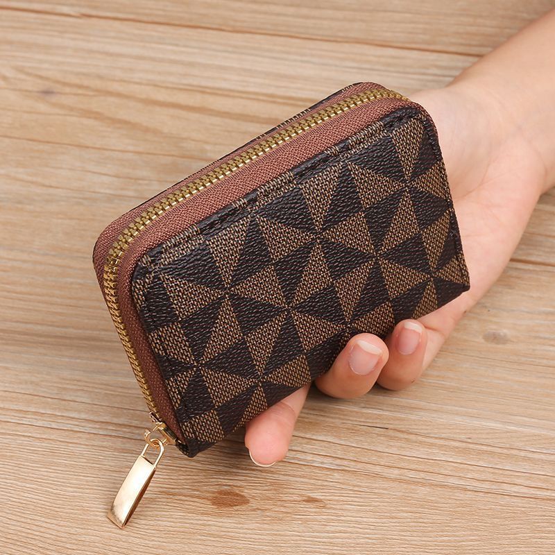 Geometrisch gemusterte Reißverschluss-Münztasche Brehn