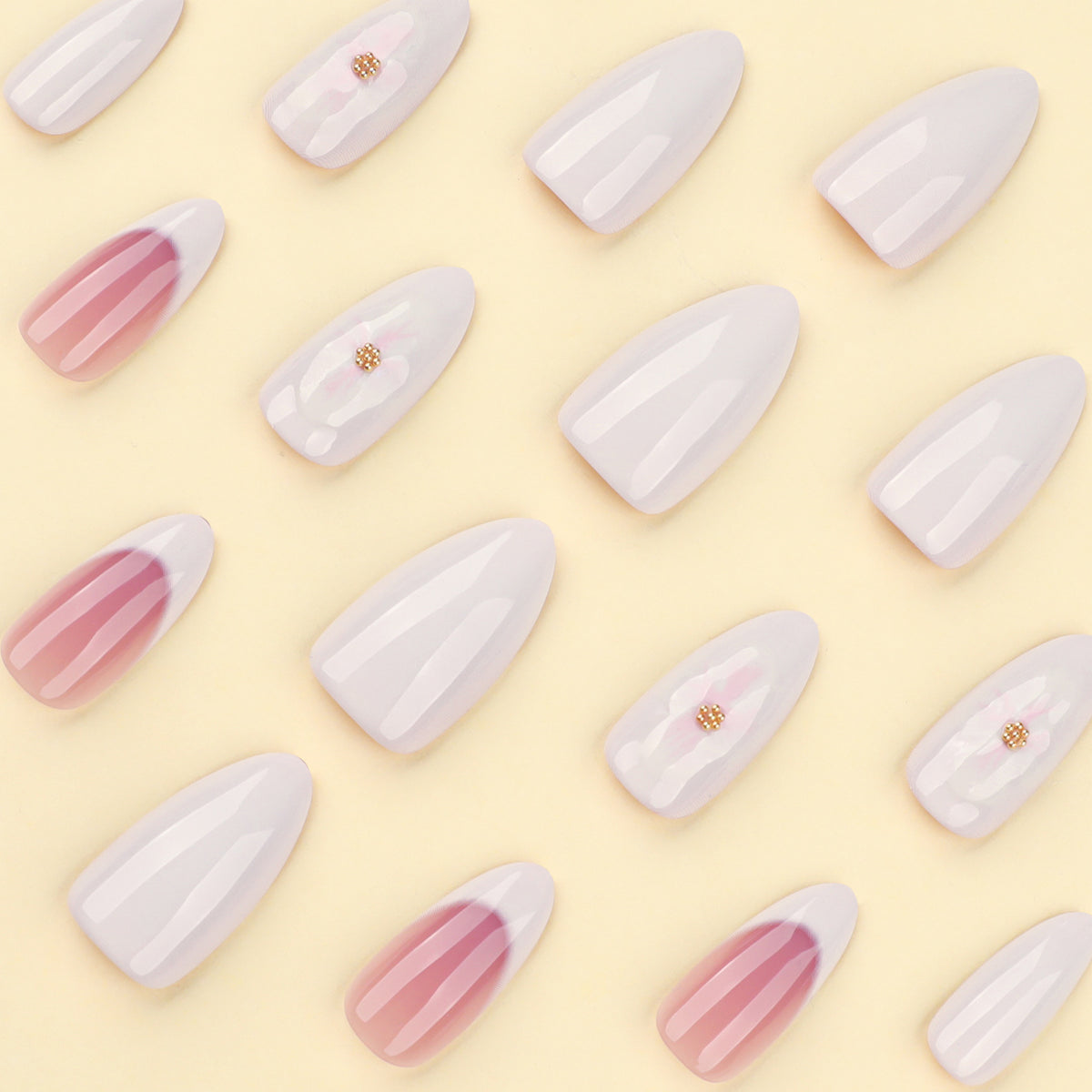 Kunstnägel mit Blumenakzenten und French-Tip Brehn