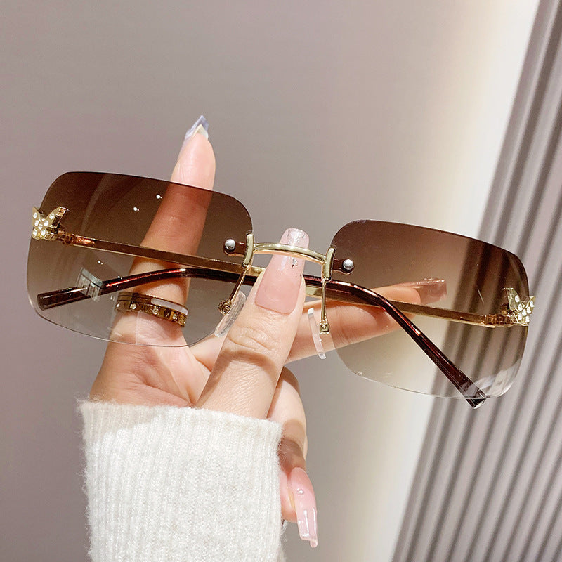 Damen elegante oversized Sonnenbrille mit gewebtem goldenen Rahmen Brehn