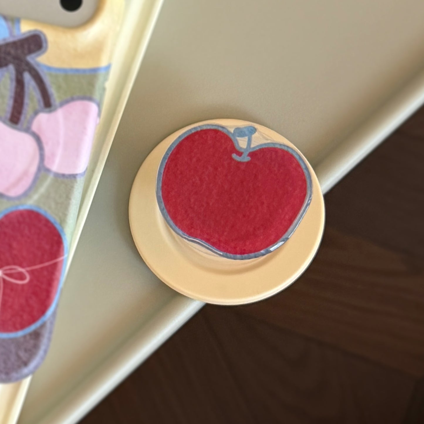 Smartphone Fingerhalter im Apfelmotiv Brehn