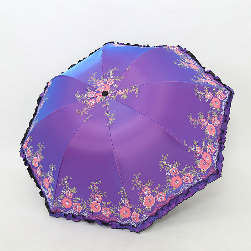 Damen Regenschirm mit fröhlichem Blumendruck und Wellenrand Brehn